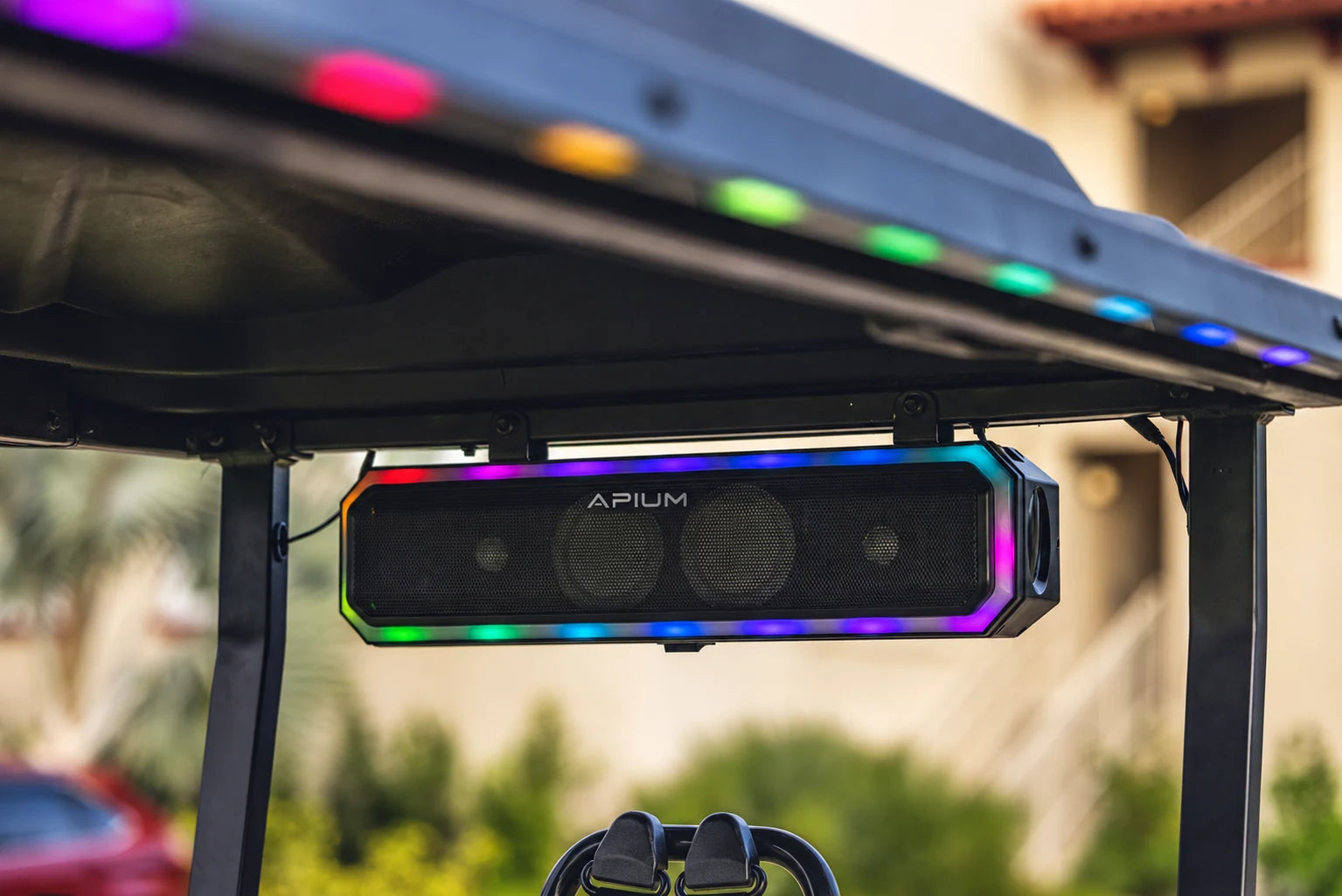 APIUM-branded overhead soundbar with colour lighting