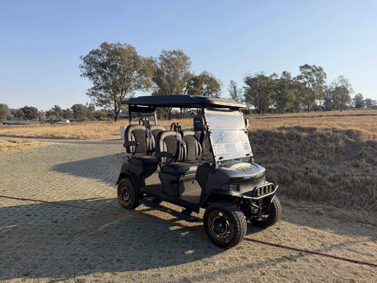 Delivered cart beside a golf course