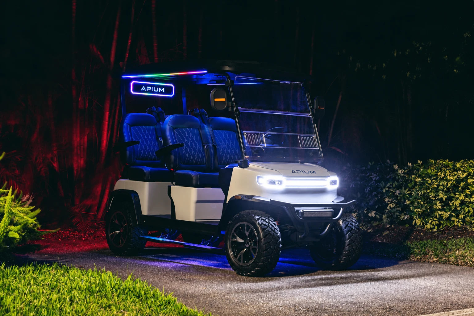 APIUM A4 with LED headlights and colourful cabin lighting at night