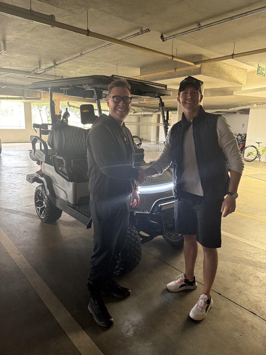 Customers with their cart at an indoor handover