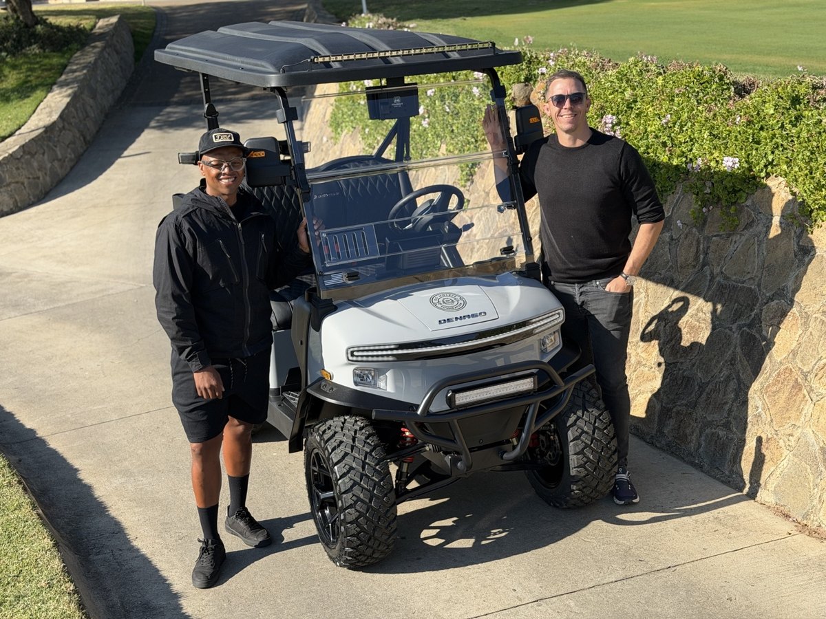 Customers beside a white Denago cart