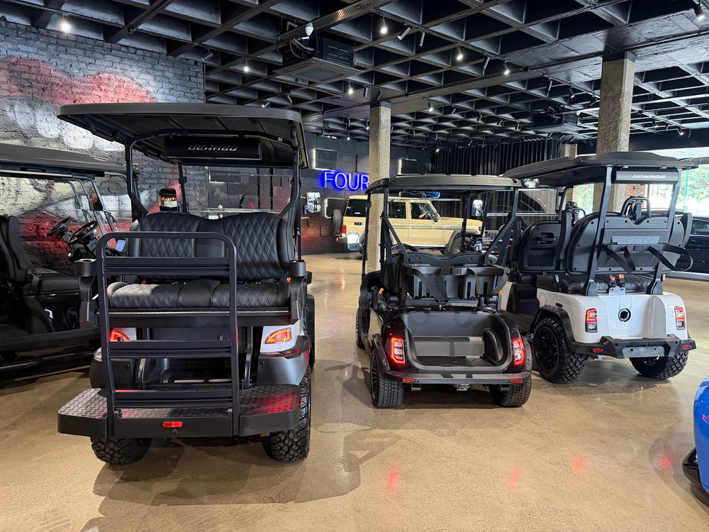 Golf carts on display inside the Fourbuy Cart Co showroom