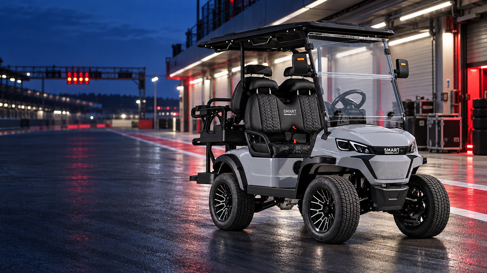 Grey Smart Cart with black seats in a race-day pit lane